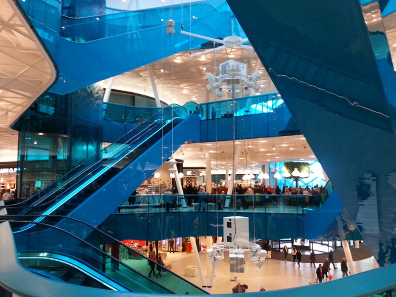 interior blue escalators at the Emporia shopping center in Malmo, Sweden