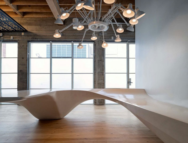 Reception desk and chandelier at Giant Pixel Headquarters in San Francisco designed by Studio O+A