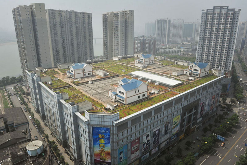 cityscape of Zhuzhou and houses on roof of shopping mall
