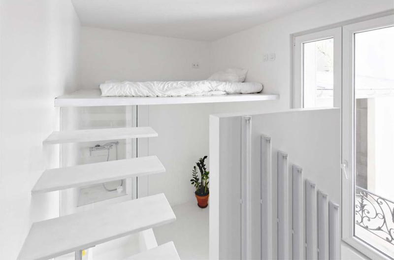 stairs and bedroom in a micro studio apartment in Paris