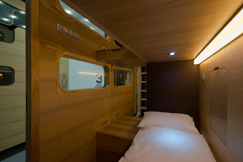Interior view of room and bed of the Sleepbox Mobile Hotel in Tverskaya