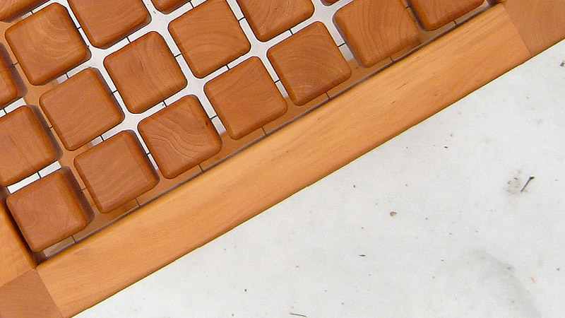 Closeup of the wooden cubes and piano cables in the SQUAT chair by Martin Rille