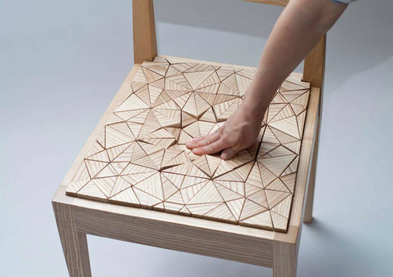 Triangular wooden pieces on the Squishy Chair by New Colony Furniture