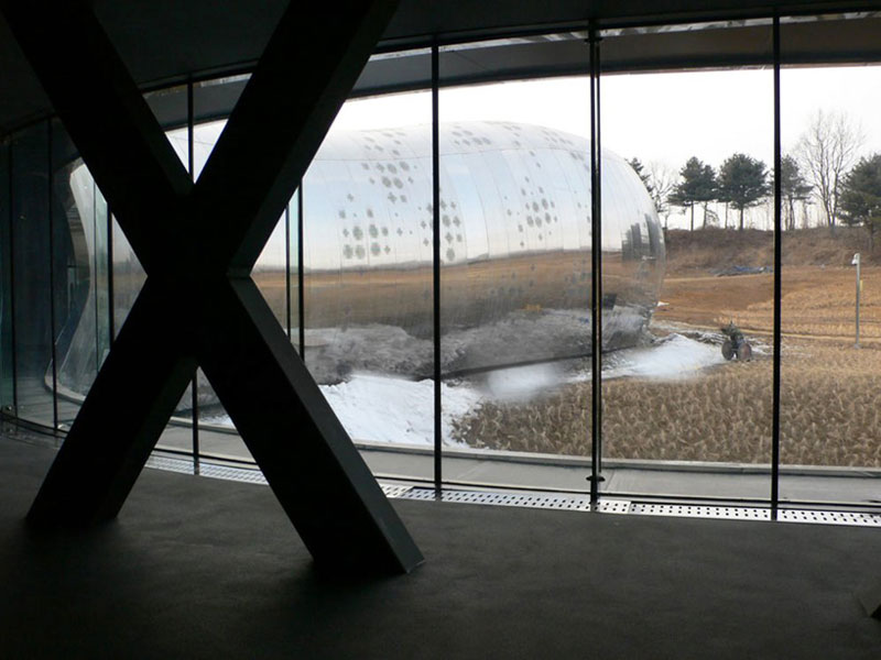 View of the outside from inside the Jeongok Museum South Korea Prehistory Museum by X-TU Architects