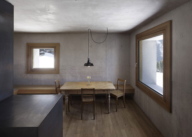 Wooden dining table and chairs at the Mountain Cabin by Marte.Marte in Voralberg Austria