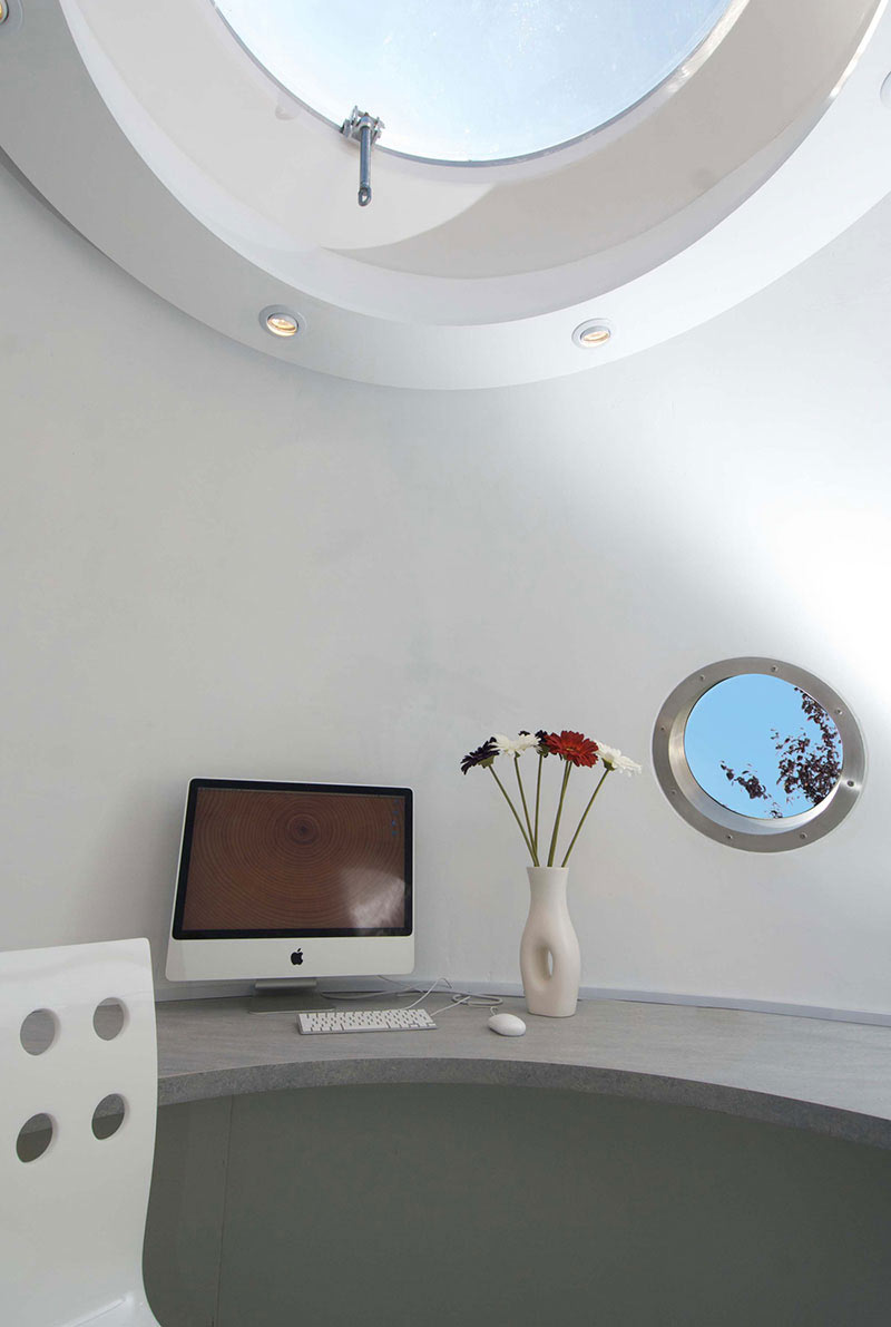 interior design with skylight and window of The Pod Garden Office by Archipod