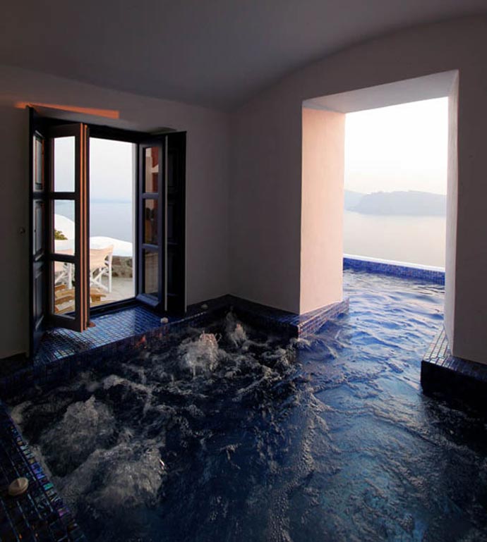 Indoor and outdoor pool at the Ikies Traditional Houses in Santorini
