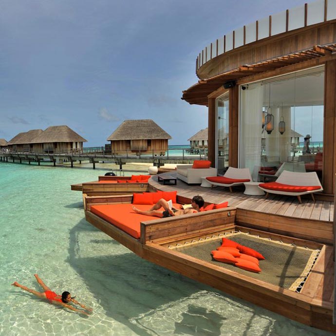 Patio area of a water bungalow at Club Med Maldives