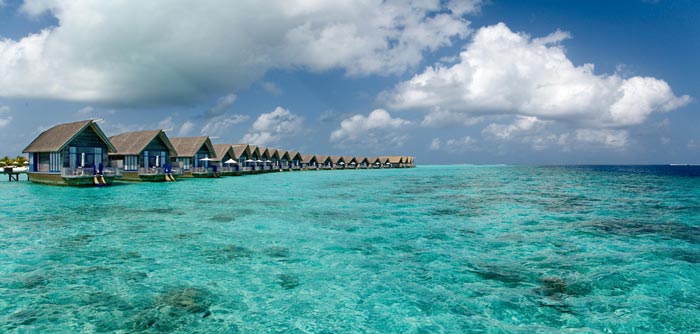 Bungalows on the water at Cocoa Island Resort in The Maldives