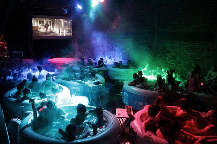 Hot Tub Rooftop Cinema at Rockwell House in London during the night