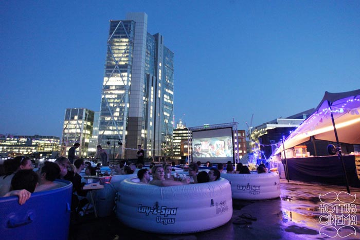 People in Hot Tubs at the Rooftop Cinema at Rockwell House in London