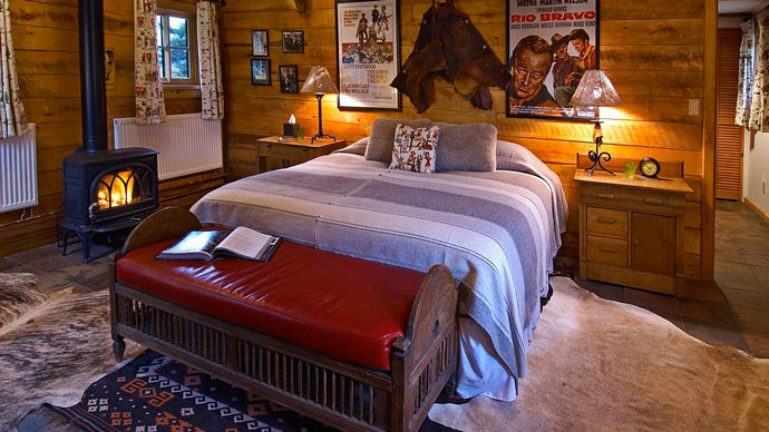 Bed in a wooden lodge
