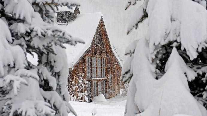 A lodge covered in snow at Dunton Hot Springs Resort