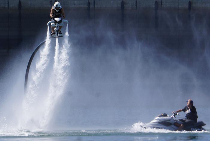 Man using the Jetovator Flying Water-Propelled Bike with a sea-doo