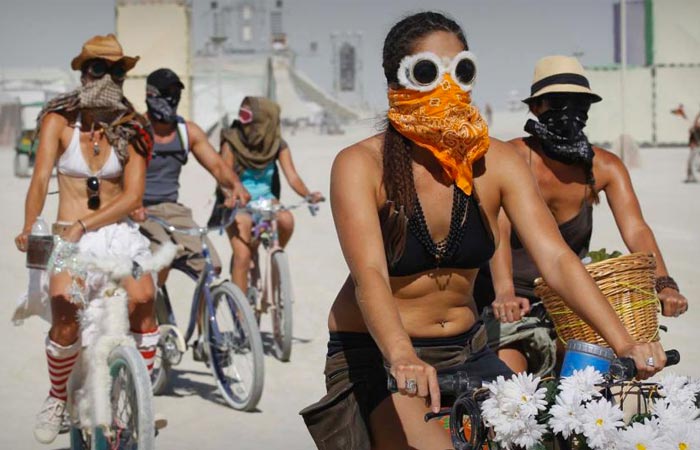 People riding bikes at the Burning Man Festival