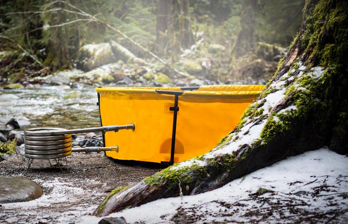 Nomad collapsible hot tub heated by firewood, propane or coal