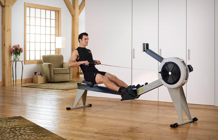man working out on a rowing machine