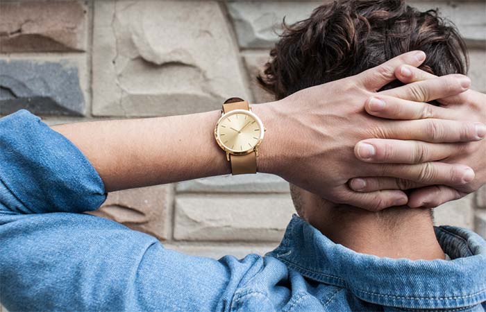 A guy wearing golden Classic Collection Analog Watch 