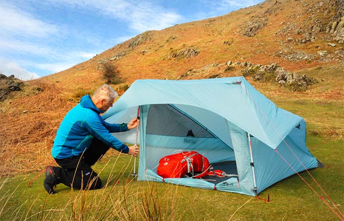A guy pitching MSR Flylite 2-Person Tent