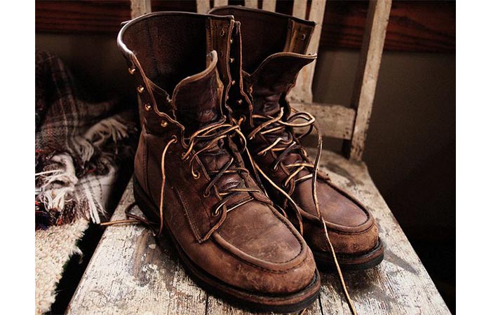 The pair of worn out Filson Men's Water-repellant Uplander Boots