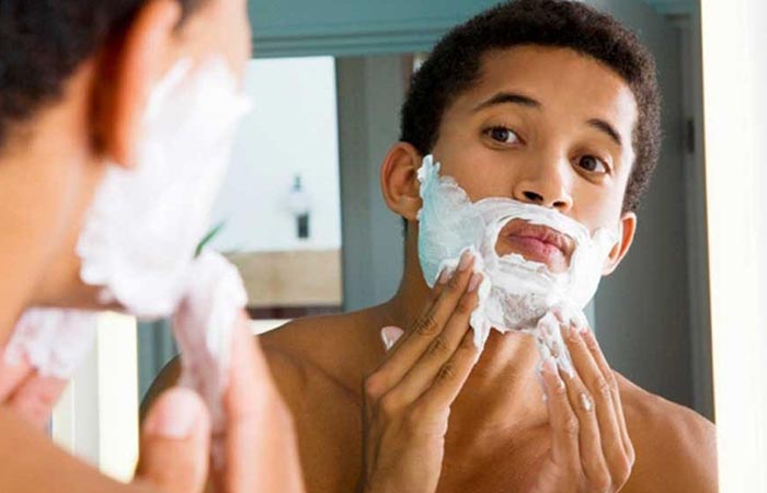 Man shaving beard