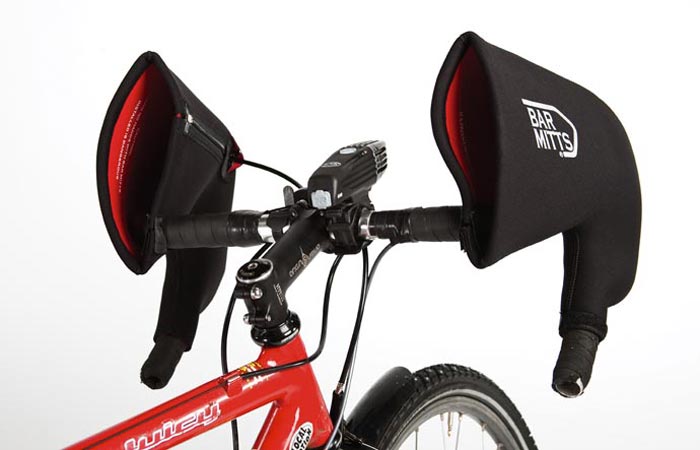 The Bar Mitts Hand Covers, black/red, attached to a red bicycle.White background.