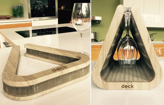 Deck Goblet Holder, closed and extended with glasses hung in it, on a kitchen worktop.