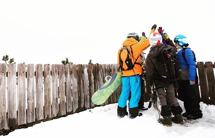 Four people wearing LinkPro Sports 'Explore1' Skiing Helmets 
