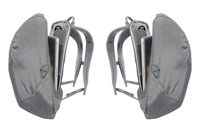 Two North Face Access Packs, grey, slightly open with a laptop inside, oriented in opposite sides.