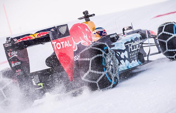 Formula 1 car drifting on the snow. 