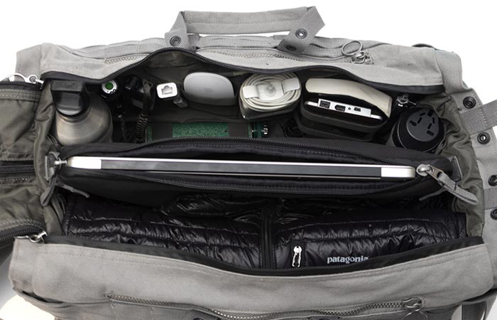 Able Archer Duffel, cement, with the laptop in the center sleeve and numerous accessories in other compartments. Upper view.