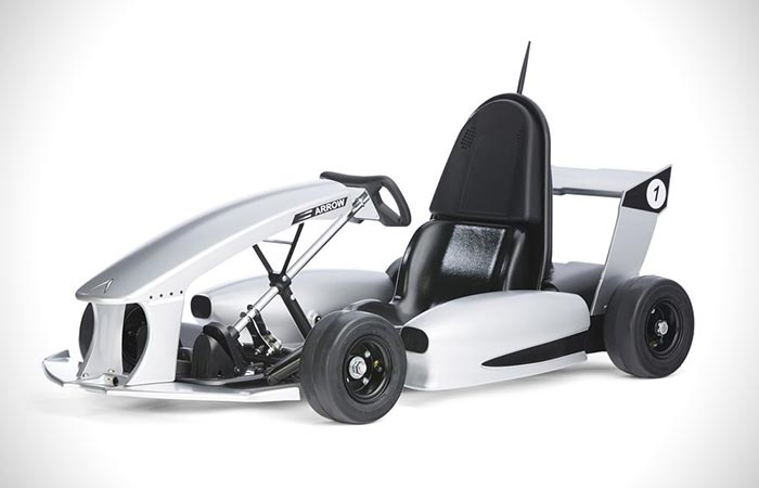 A white Smart-Kart captured from the side. 