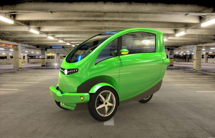 Veemo Velomobile, green, on an indoor parking, tilted.