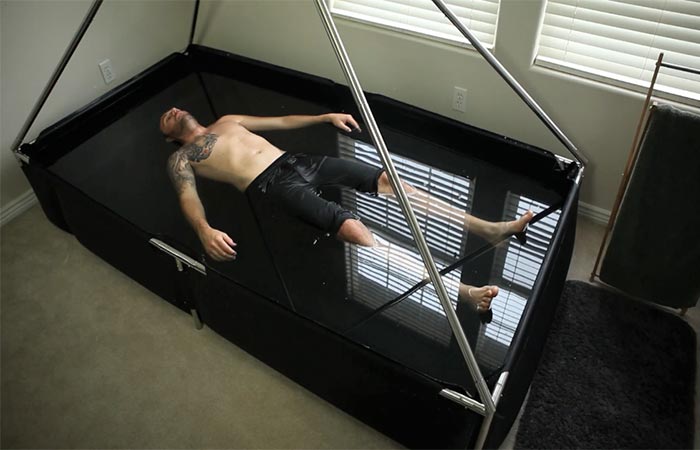 A guy floating in an isolation tank