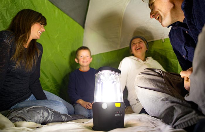 Family Insde A Tent Using CampGuard Perimeter Security Camping Lantern