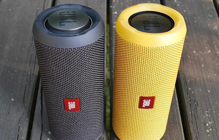 JBL Flip 3 black and yellow next to each other