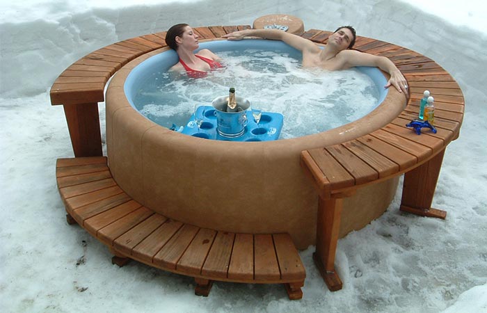 A Couple Sitting In Softub