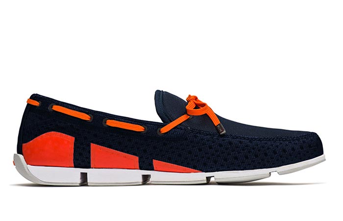 Side view of navy and orange SWIMS Breeze