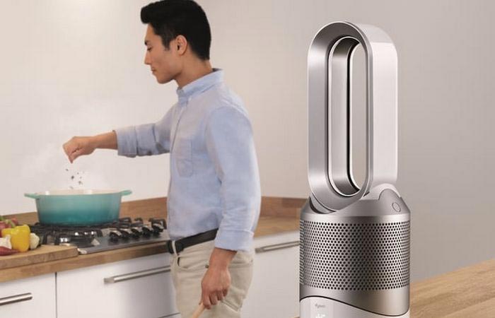 A Guy Coking With Dyson Pure Hot+Cool Link Next To Him
