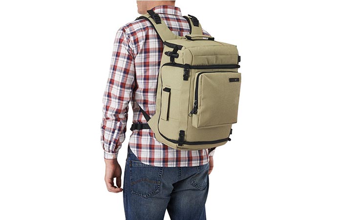 A Guy Waring Slate Green Pacsafe Camsafe Z25 Anti-Theft Camera And Laptop Backpack
