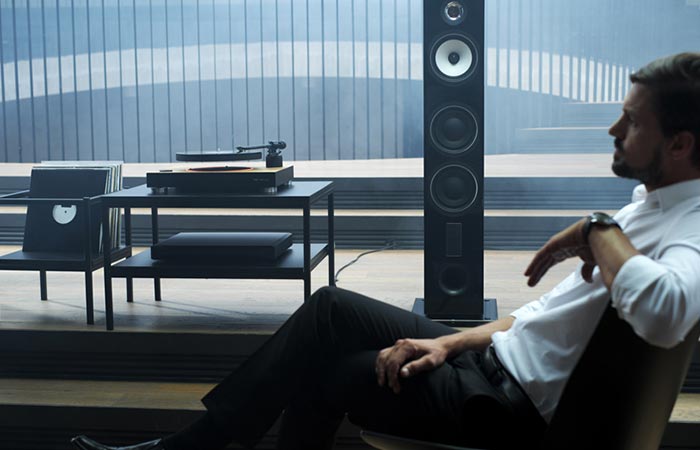 Man listening to music with the Mag-Lev Audio Turntable