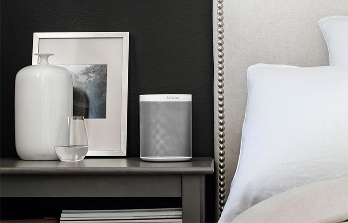White Sonos Play 1 Next To A Bed