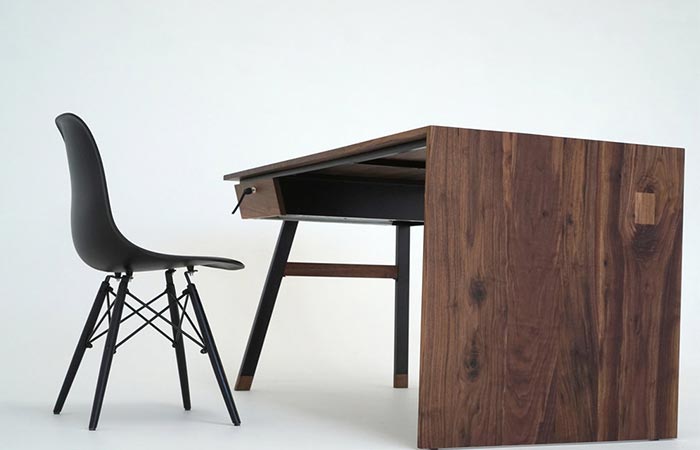 a wooden desk with a chair