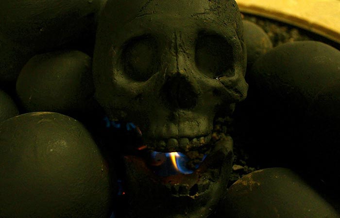Flame burning inside the mouth of Skull Gas Fireplace Log