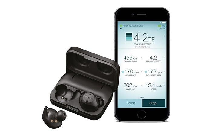 Jabra Elite Sport in a charging case next to a phone