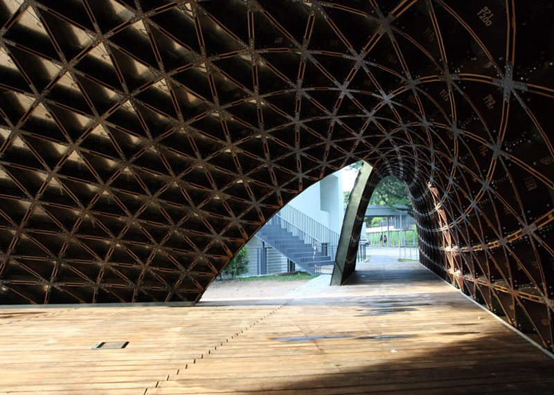 Interior view of the arc made out of plywood boards at the SUTD Library Pavilion designed by City Form Lab