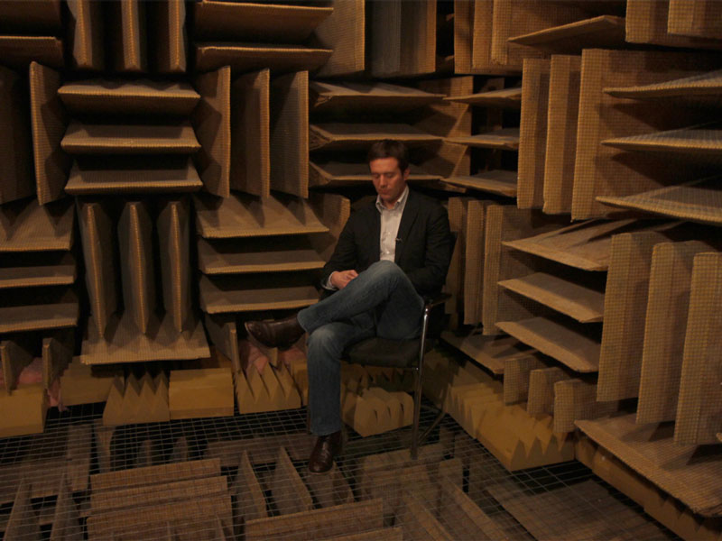 men sitting in the world's quietest room in Orfield Labs in Minneapolis
