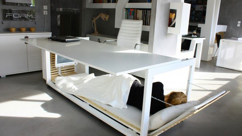 work desk bed with a person sleeping inside Studio NL 1