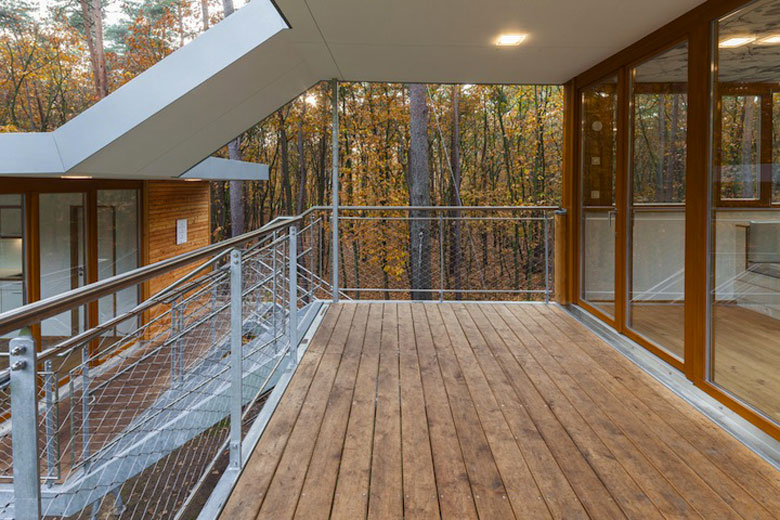 Patio area with wooden floors at Baumraum's Treehouse Retreat