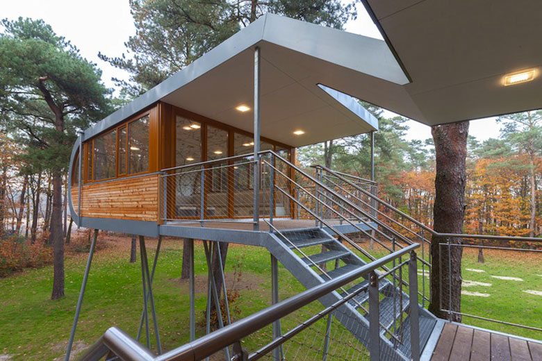 Exterior view of Baumraum's Treehouse Retreat and the metal stairs that take connect to it